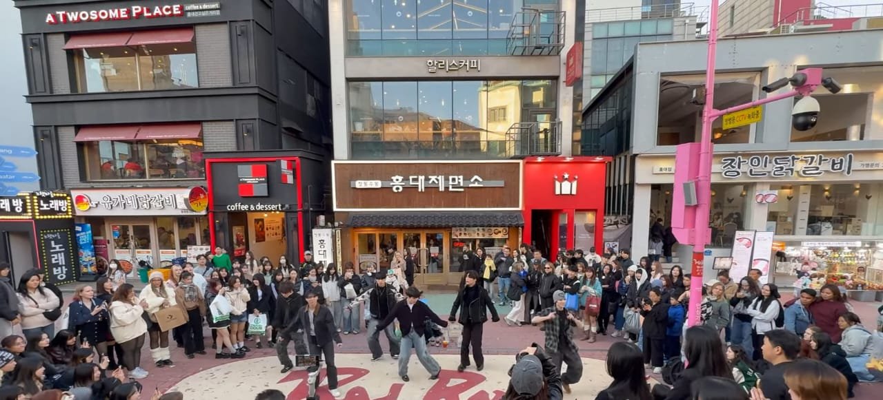 Lively night scene in Itaewon, Seoul with restaurants and people