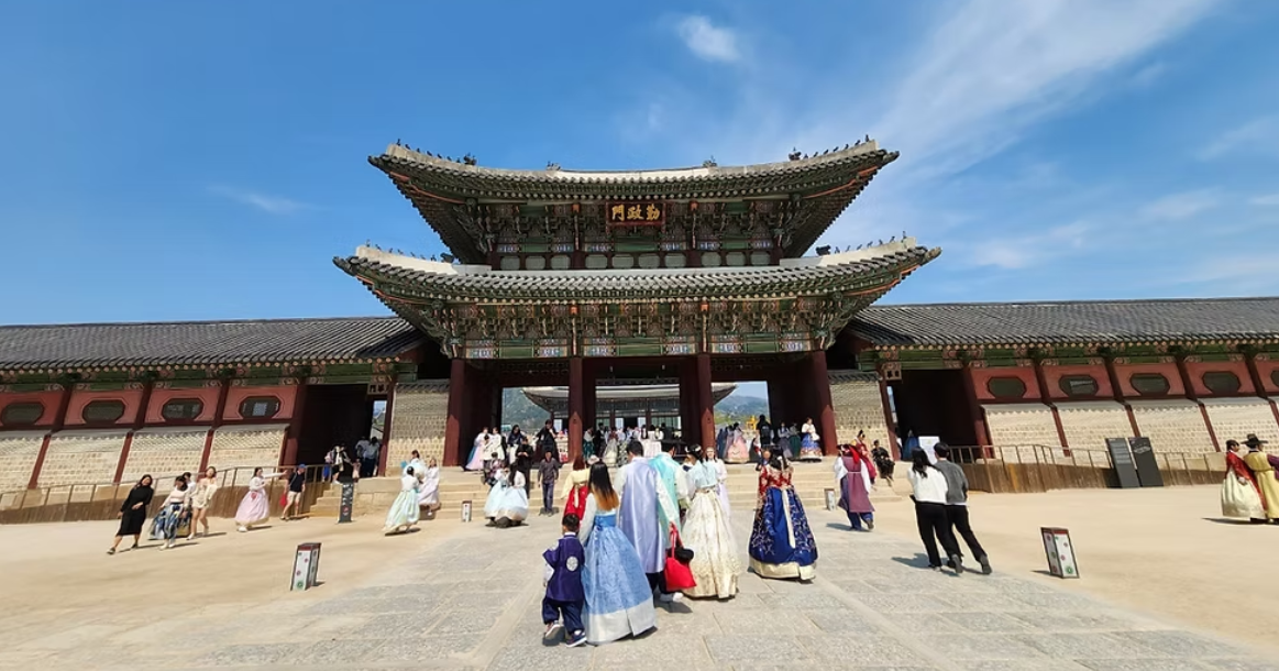 Visitors wearing hanbok at Gyeongbokgung Palace in Seoul, South Korea