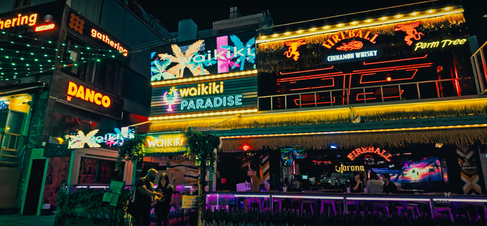 Lively night scene in Itaewon, Seoul with restaurants and people