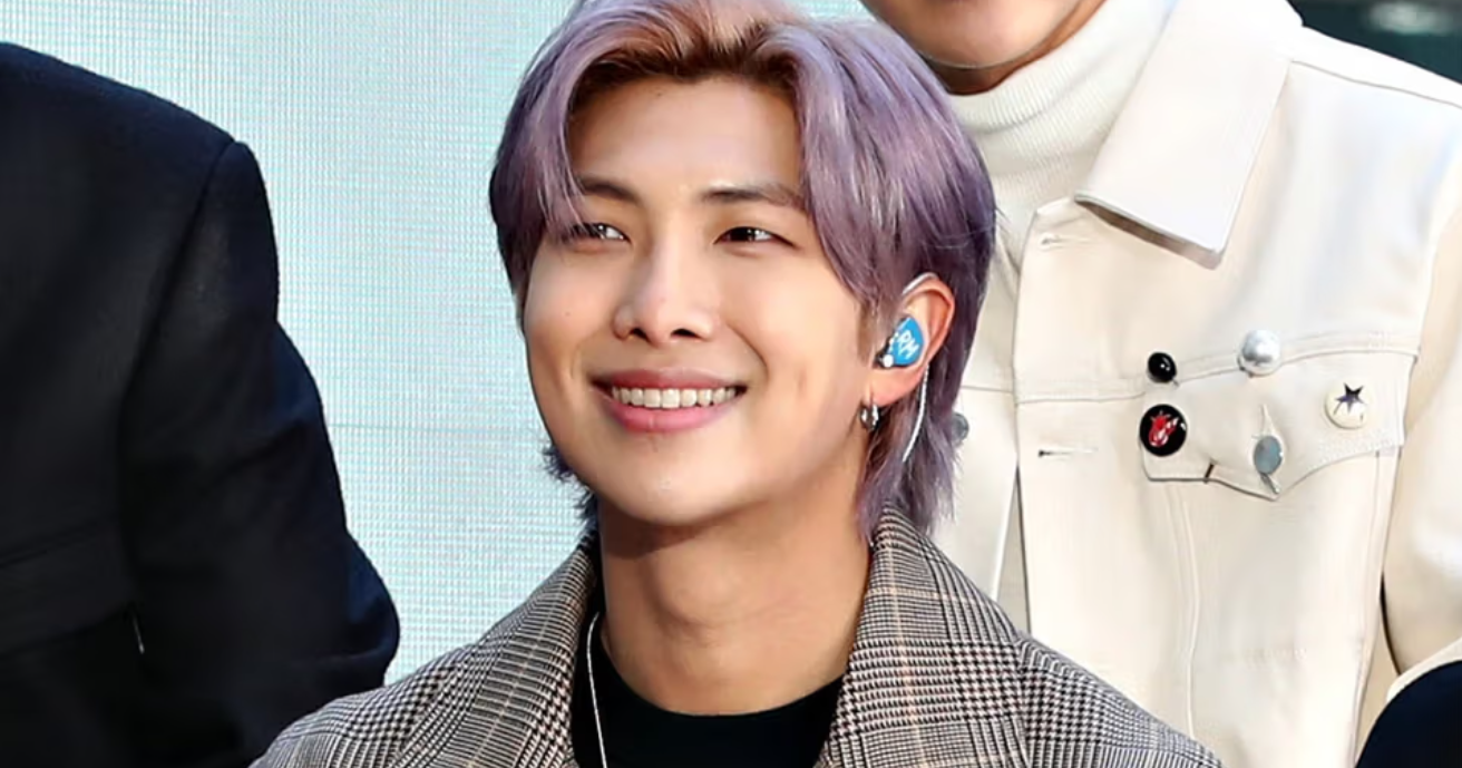 BTS's leader RM looking thoughtful, a K-pop idol known for his genius-level IQ of 148 and profound lyrics.