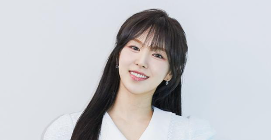 Red Velvet's main vocalist Wendy smiling, a brilliant K-pop idol who received a US Presidential Award for her academic excellence.
